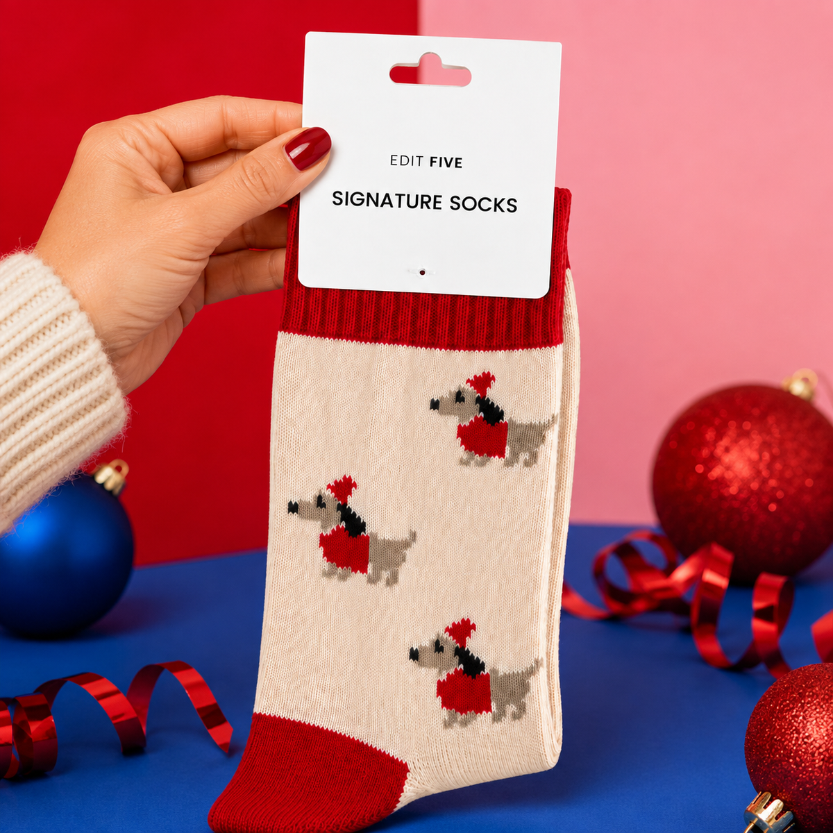 Soft cream novelty dog socks featuring festive dachshunds, bright red details and a cosy wool blend. Fun Christmas gift socks for winter outfits, festive mornings and dog lovers.