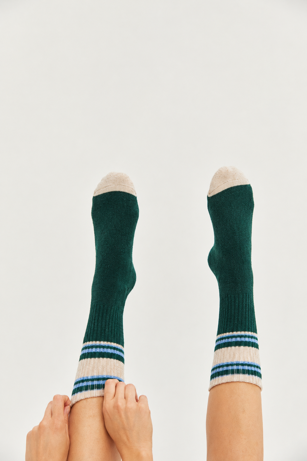 Colourful women’s wool-blend socks featuring contemporary green, peach and blue stripes—a stylish fashion accessory, cosy winter essential and thoughtful gift for her.