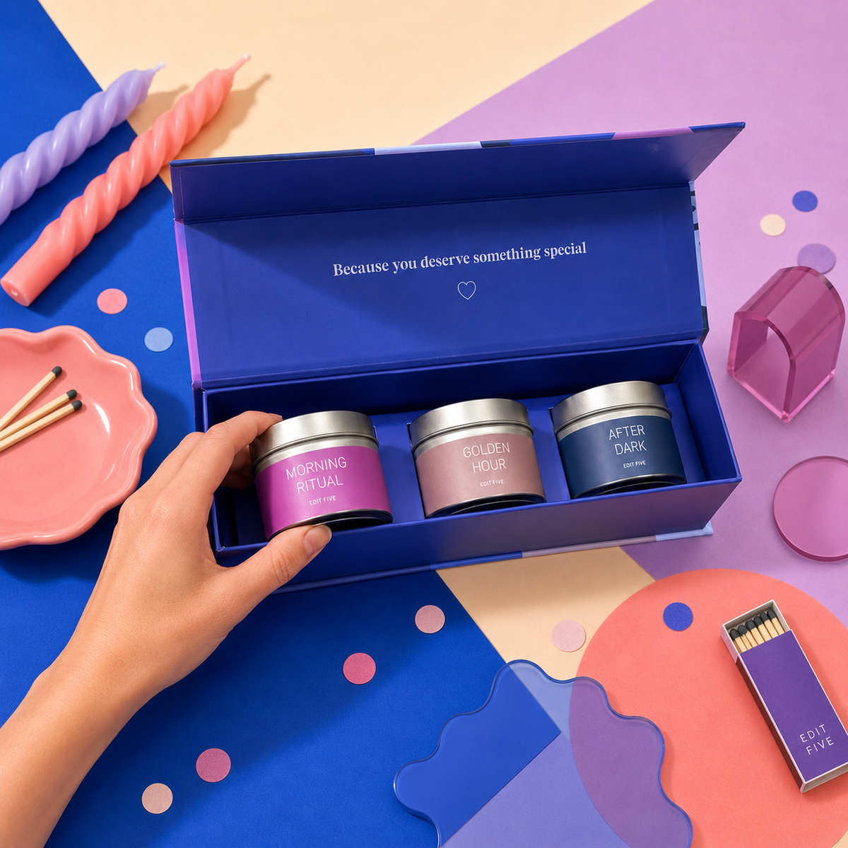Edit Five luxury scented candle gift box containing three 80g gold tin candles with coffee and vanilla, bergamot and warm woods, and tobacco, cedarwood and amber fragrances, offering over 36 hours of home fragrance.