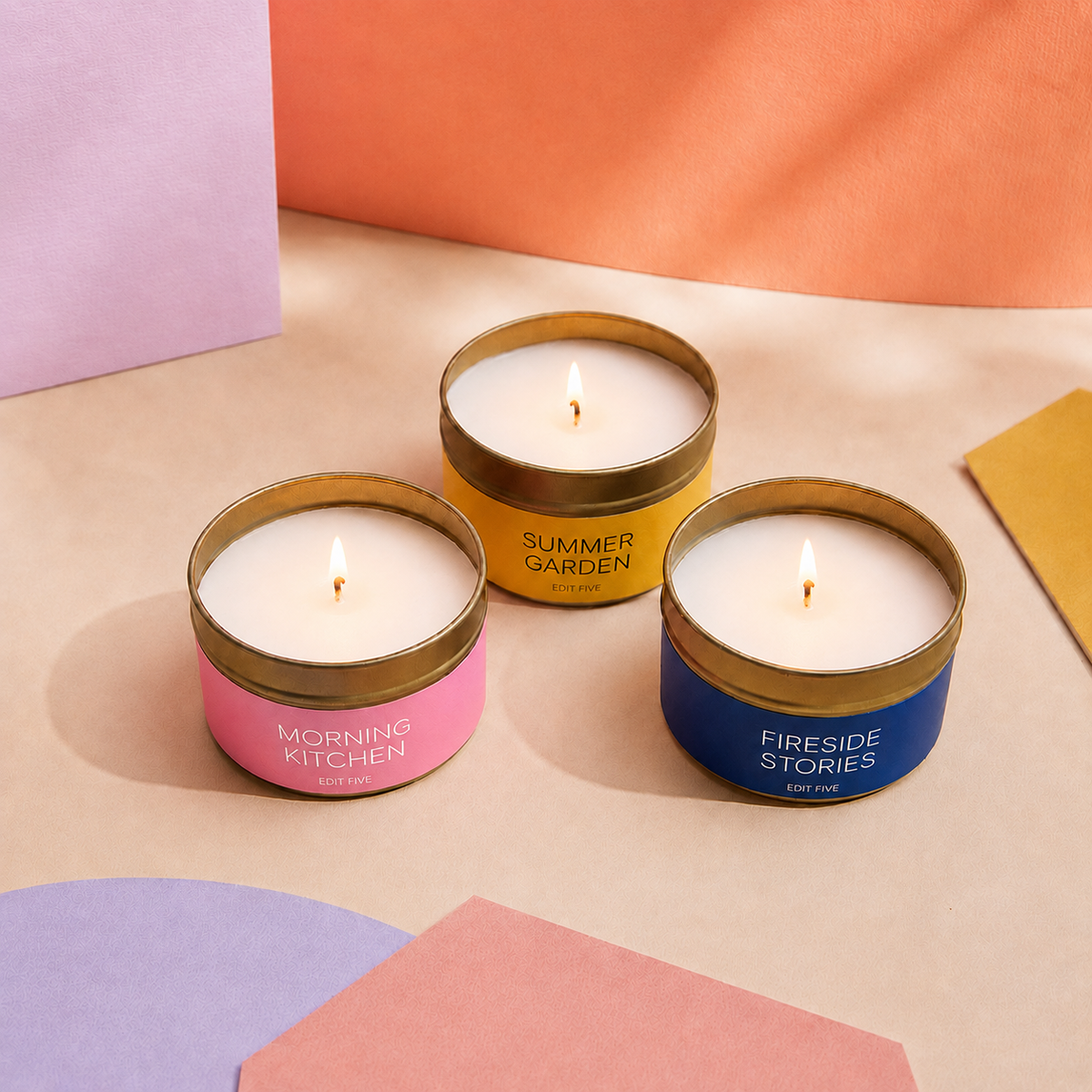 Edit Five luxury candle gift box containing three 80g scented candles in Morning Kitchen, Summer Garden and Fireside Stories fragrances, offering over 36 hours of premium home fragrance.