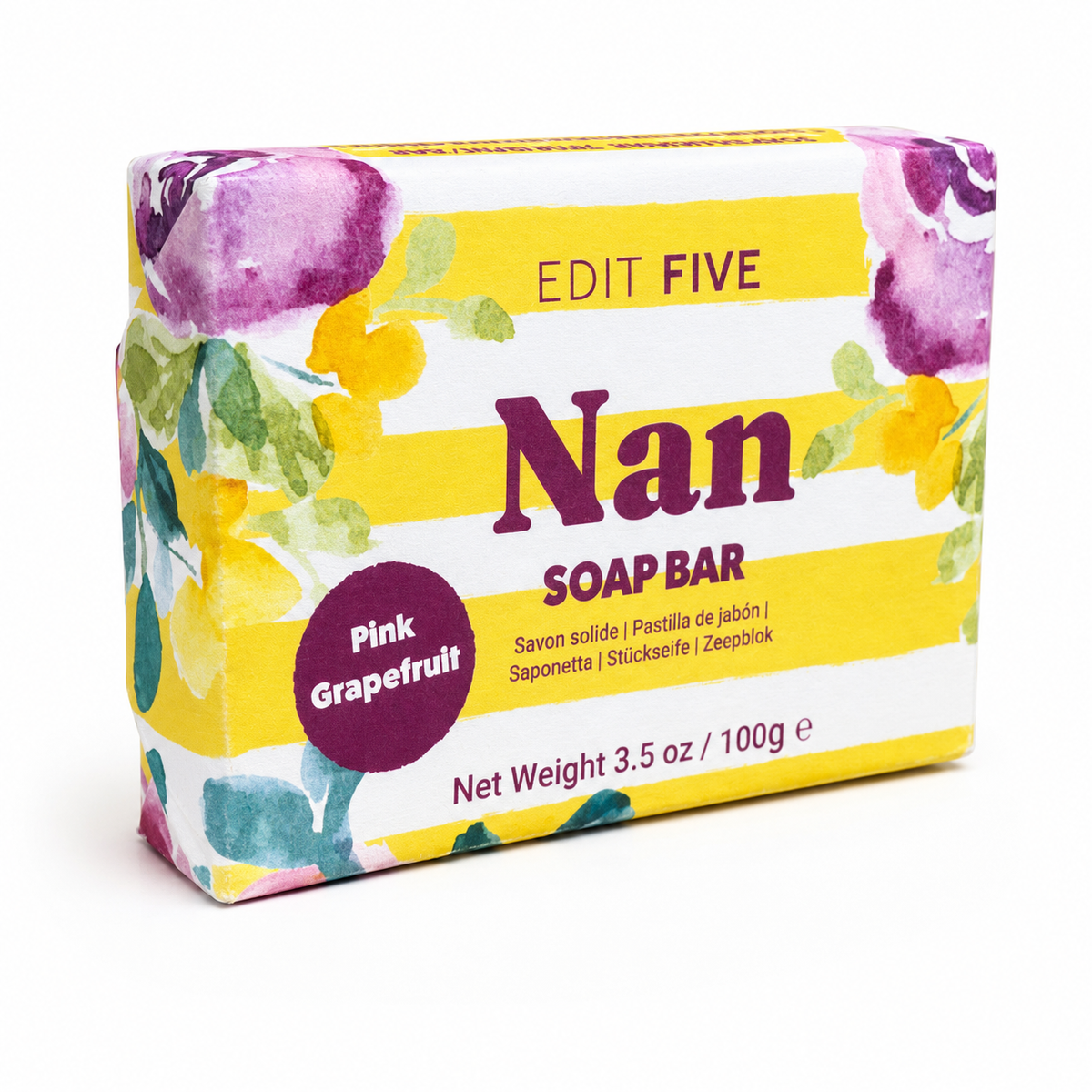 A packaged soap bar box labeled 'EDIT FIVE Nan SOAP BAR' with 'Pink Grapefruit' on a purple badge. The box has a yellow-and-white striped design with watercolor floral accents in purple, green, and yellow, photographed on a clean white background. Natural pink grapefruit soap bar handmade in England—a thoughtful gift for Grandma or Nan for Mother’s Day, birthdays, Christmas, thank-yous or simply to show she is loved.