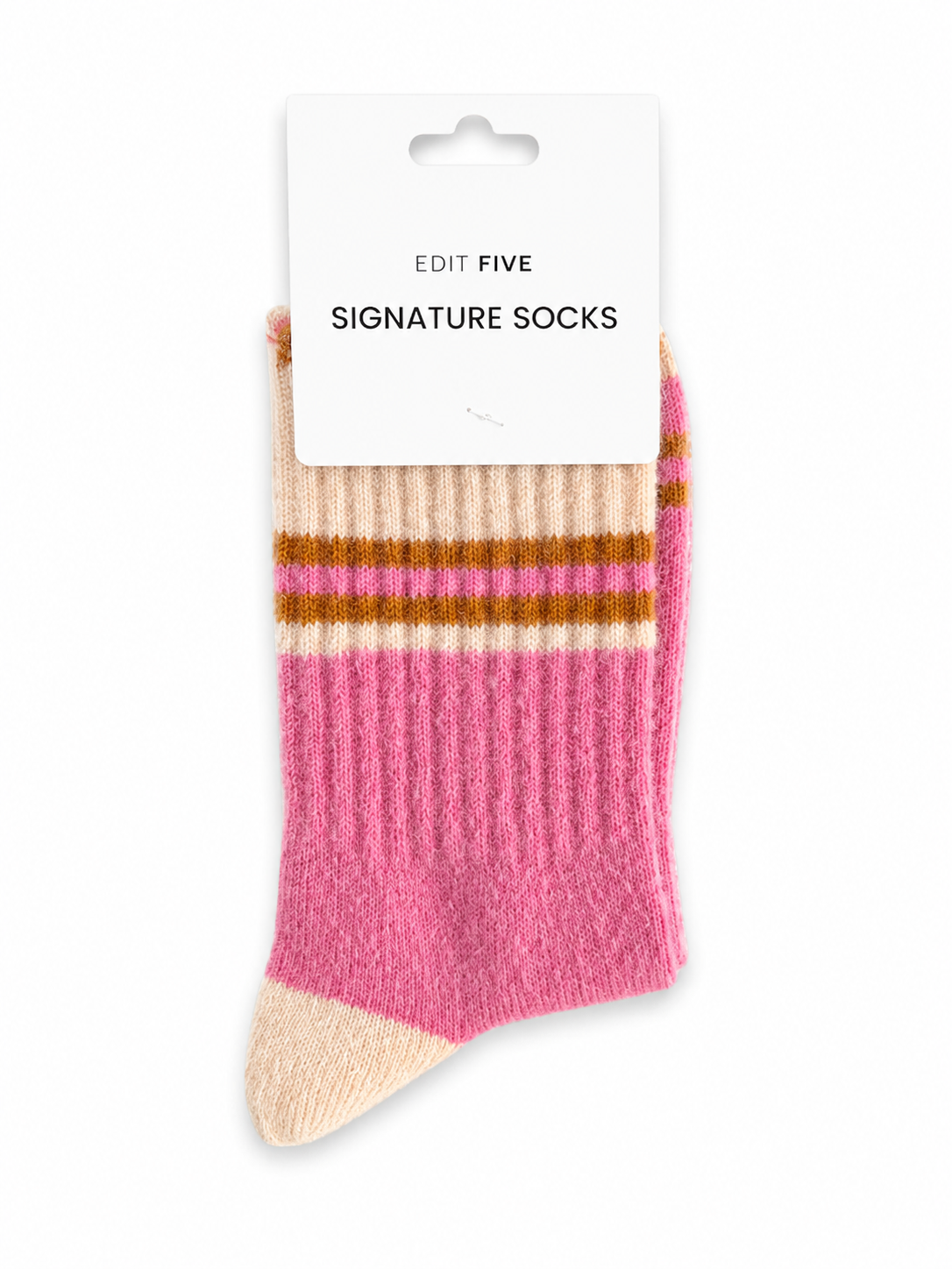 A pair of pink and beige ribbed socks with brown stripes, packaged on a white card labeled 'EDIT FIVE SIGNATURE SOCKS' against a white background. Soft pink, peach and orange striped socks for women with a durable, flexible fit, ideal for lounging at home, styling with trainers, casual outfits and colourful sock gifts.